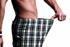 A man looks at his penis and wants to enlarge him
